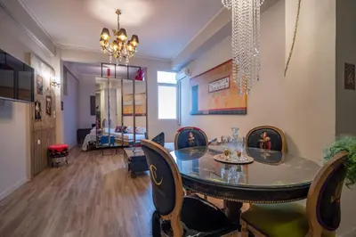 a dining room with a glass table and chairs at Athenian Urban Art Apartment - Live Athenian Life in Athens