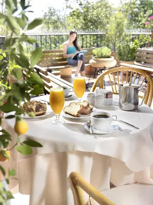 a white table with food and drinks on it at Adrian Hotel in Athens
