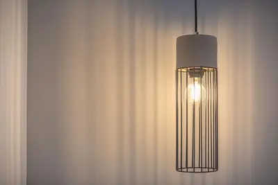 a hanging light in a room with a curtain at Elegant & Spacious Apartment in Athens