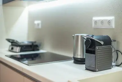 a coffee maker on a counter in a kitchen at Acropolis Diamond in Athens