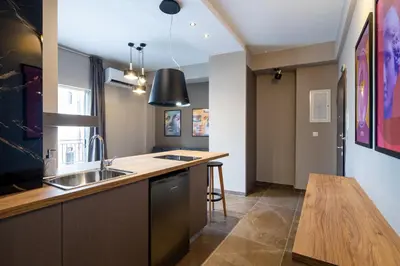 a kitchen with a sink and a counter at The Acropolis Pathway in Athens