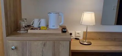 a counter with a blender and a lamp on it at ALPHA APARTMENTS Free Shuttle from and to the Airport in Spáta