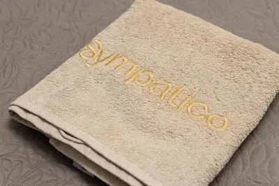 a towel with the word congratulations written on it at Sympatico Glyfada Downtown in Athens