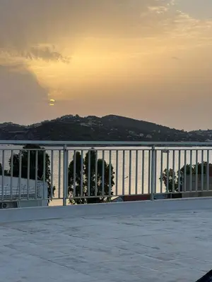 a view of the water from a balcony of a building at Athens Palaia Fokaia Entire Flat 2 bedrooms with panoramic sea views and a massive veranda , only steps away from the beach and amenities in Palaiá Fókaia