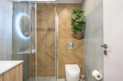 a bathroom with a shower and a toilet at Athens Home in Athens