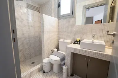 a bathroom with a toilet and a sink at Chic 1BR Apartment in Neo Psichiko in Athens