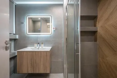 a bathroom with a sink and a shower at Home In Athens in Athens