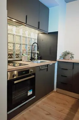 a kitchen with a sink and a stove at Elegant 42sqm Apartment in Lycabettus in Athens