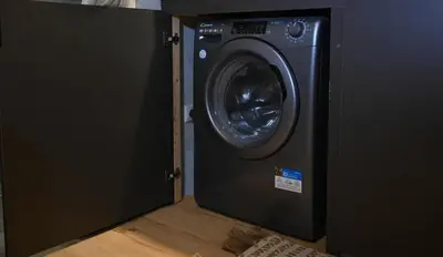 a washer and dryer is in a room at Elegant 42sqm Apartment in Lycabettus in Athens