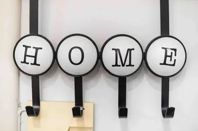 a group of black and white signs on a wall at Home In The Alimos Marina in Athens
