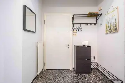a room with a white door and a refrigerator at Home In The Alimos Marina in Athens