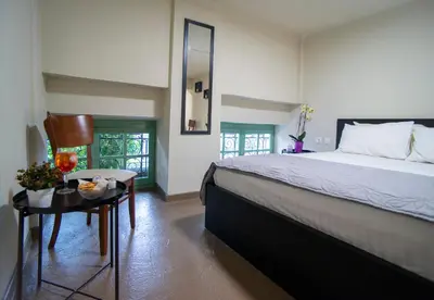 a bedroom with a large bed and a table at Ancient Agora Plaka in Athens