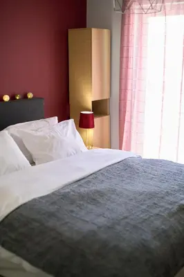 a bedroom with a large bed with a window at Sea-View Apt Argyroupoli, Athens in Athens