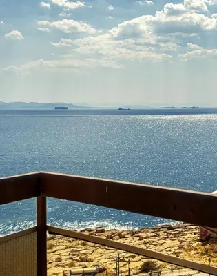 a view of the ocean from a balcony at Above the Sea in Piraeus