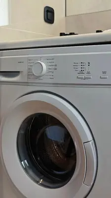 a white washing machine with its door open at Costa Voula Private Pool Penthouse by the Beach in Athens