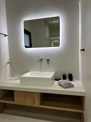 a bathroom with a white sink and a mirror at Parthenon view apt in Athens