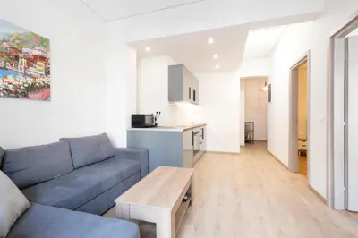 a living room with a couch and a table at Modern 2-Bedroom Gem close to Metro in Athens