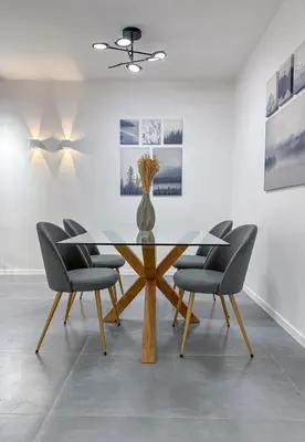 a dining room with a glass table and chairs at LIV - Modern Comfort Oasis in Pagrati in Athens