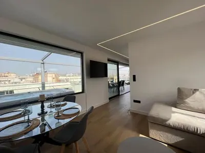 a dining room with a table and a large window at BlueMotion - PortDome in Piraeus