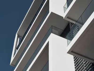 a close up of the facade of a building with skyscrapers at AVA Hotel & Residences Athens Riviera in Athens