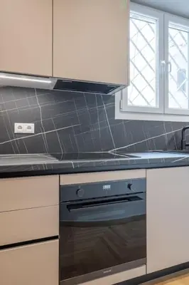 a kitchen with a stove and a counter top at Urban Elegance in Kolonaki in Athens