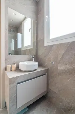 a bathroom with a sink and a mirror at Urban Elegance in Kolonaki in Athens