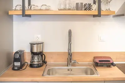 a kitchen counter with a sink and a mixer at Superior Αpartment in Athens