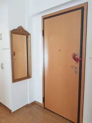 a door in a room with a mirror at Urban by the Sea in Piraeus