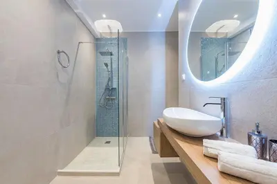 a bathroom with a sink and a glass shower at Cozy Home In Athens in Athens