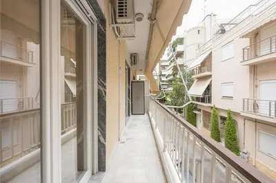 an empty balcony of a building with a hallway at Cozy Home In Athens in Athens