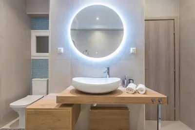 a bathroom with a white sink and a mirror at Cozy Home In Athens in Athens