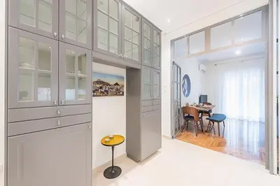 a room with a hallway with a dining room at Cozy Home In Athens in Athens