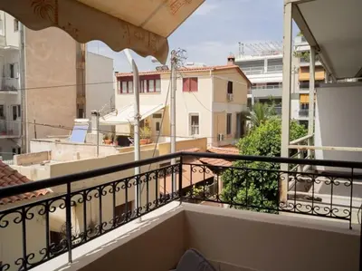 a balcony with a view of a city at Athens Hill of Harmony in Athens