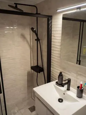 a bathroom with a sink and a shower with a shower at Athens Hill of Harmony in Athens