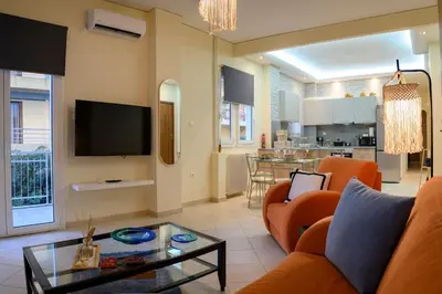 a living room with a couch and a table at Salty 2bed Bliss and Comfort in Athens