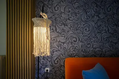 a chandelier hanging over a bed in a bedroom at Salty 2bed Bliss and Comfort in Athens
