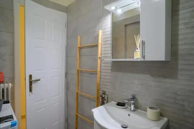 a bathroom with a sink and a mirror at Salty 2bed Bliss and Comfort in Athens