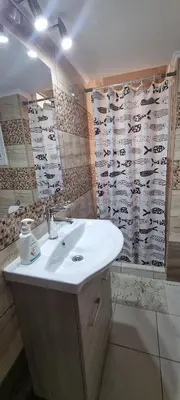 a bathroom with a sink and a shower curtain with cows at Cozzy double bedroom Apartment in Athens