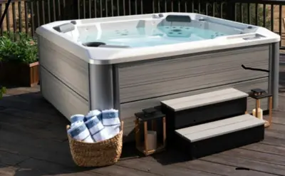 a jacuzzi tub sitting on top of a deck at St'Georges garden house in Palaiá Fókaia