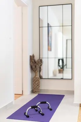 a purple yoga mat in front of a mirror at LIV - Charming 3BD in Athens Vibrant Downtown in Athens