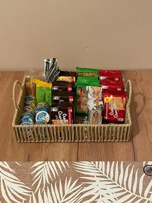 a basket filled with food and drinks on the floor at Spacious apartment near Panormou metro in Athens