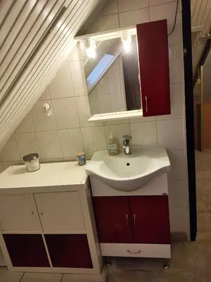 a bathroom with a sink and a mirror at Foothills loft in Keratea