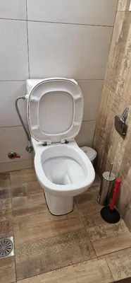 a bathroom with a toilet with the lid up at RolandApartaments in Athens