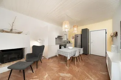 a kitchen and dining room with a table and chairs at Kalesma Hilltop Apartment by A&D Properties in Porto Rafti