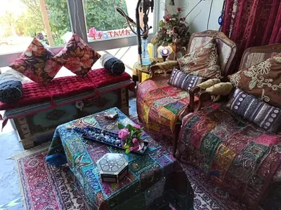 a living room with a couch and a chair at Anatoli Hotel in Agia Marina Aegina