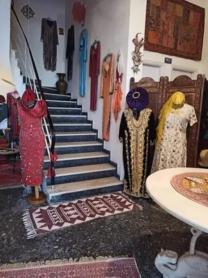 a group of clothes on display in a store at Anatoli Hotel in Agia Marina Aegina