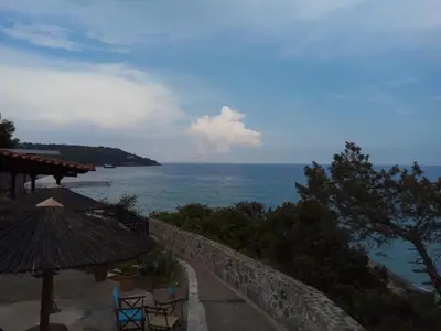a view of the ocean from a balcony of a resort at Anatoli Hotel in Agia Marina Aegina