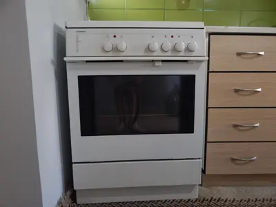 a white stove in a kitchen next to a drawer at Casa di Tsakos Luxury apartment in Athens