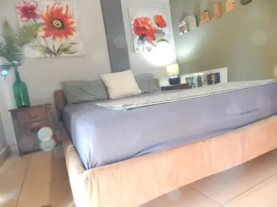 a bed sitting in a room with at Casa di Tsakos Luxury apartment in Athens