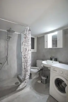 a bathroom with a shower and a toilet and a sink at Baroness Apt Piraeus Ctr 3BR, 2BA, AC, Walk to sea in Piraeus